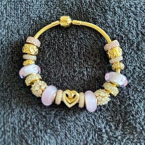 Elegant Gold and Pink Charm Bracelet